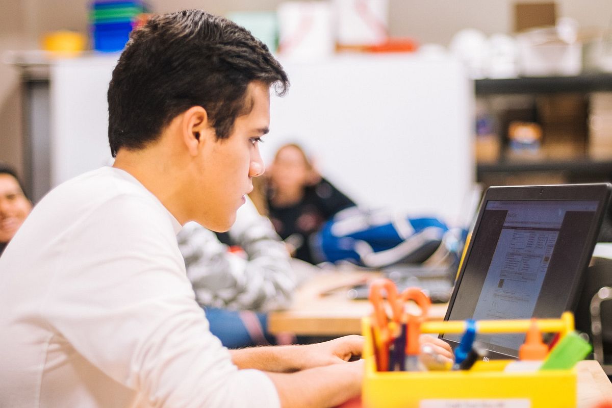 student stares intently at a laptop; classroom behavior concepts