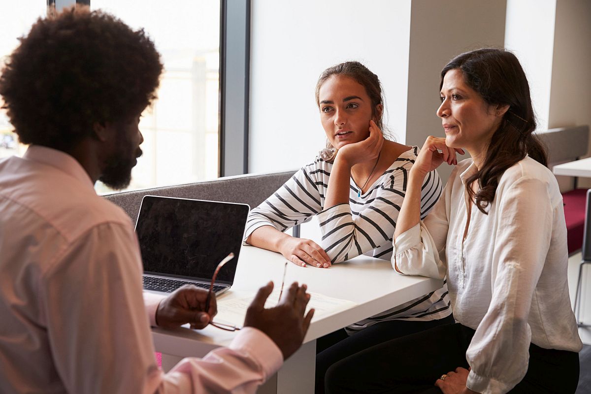 Mother And Daughter Meeting With Teacher; self-care tips for teachers concept