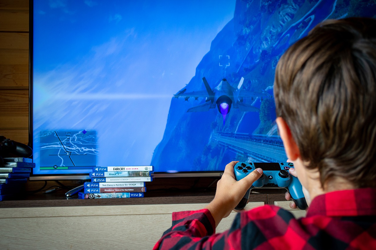 child playing a flight simulator; esports team concept