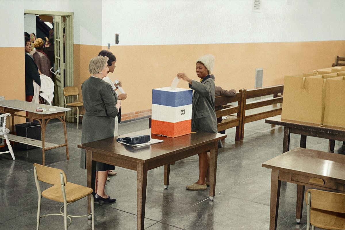 archival photo of a woman voting in the 1960s; government lesson plans concept