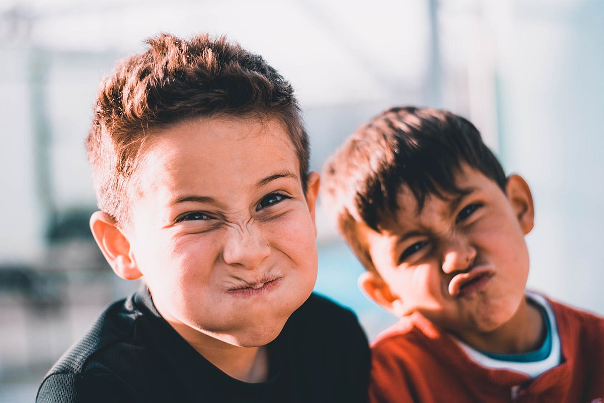 Two boys making silly faces; cultures and ethnicities concept