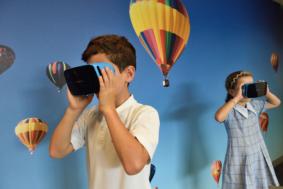 Children using augmented reality headsets; neurodiverse students concept