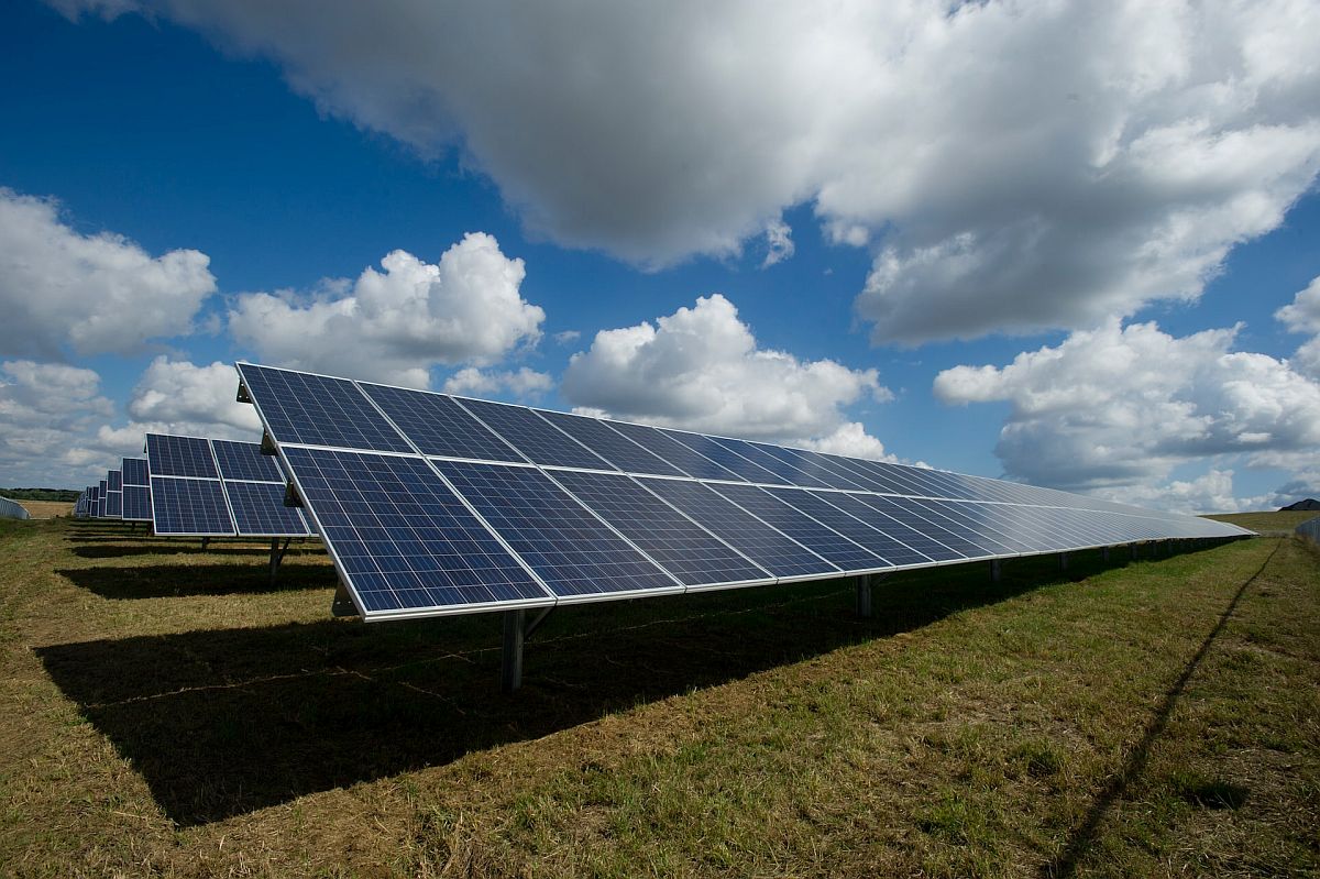 Rows of solar panels in field; renewable energy lesson plans concept